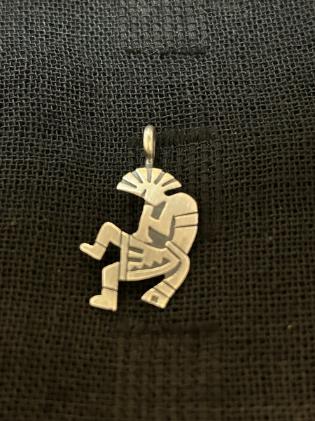 Native American handcrafted sterling silver Kokopelli pendant. NM124