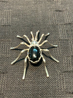 Navajo handcrafted sterling silver spider brooch with black onyx stone.  NM126