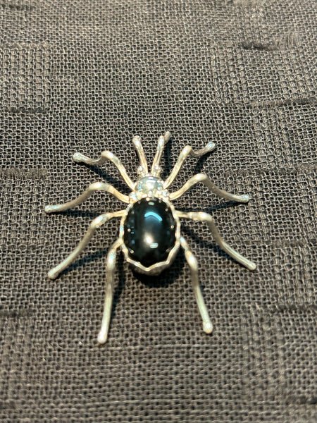 Navajo handcrafted sterling silver spider brooch with black onyx stone.  NM126