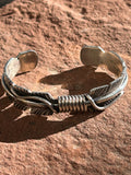 Navajo handcrafted sterling silver bracelet by Thomas Jr.  LZ068