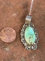 Navajo handcrafted sterling silver and genuine turquoise, pendant, 1.65” top to bottom.  LZ081