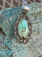 Navajo handcrafted sterling silver and genuine turquoise, pendant, 1.65” top to bottom.  LZ081