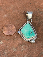 Navajo handcrafted sterling silver with genuine turquoise, 2” top to bottom, LZ085