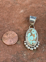 Navajo handcrafted sterling silver wit genuine #8 Mine turquoise, 1.75” top to bottom, LZ114