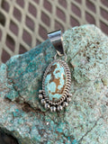 Navajo handcrafted sterling silver wit genuine #8 Mine turquoise, 1.75” top to bottom, LZ114