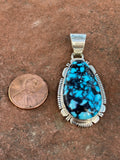 Navajo handcrafted sterling silver and genuine turquoise, 2” top to bottom, LZ122