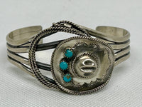 Navajo handcrafted sterling silver bracelet with genuine turquoise stones.  LZ811