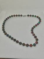 Handcrafted Jade and copper composite stone 20” necklace with hypoallergenic stainless steel beads and clasp.  EP140