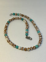 Handcrafted Howlite and turquoise stone 16”  necklace with stainless steel clap.  EP142