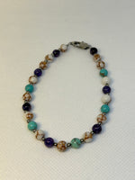 Handcrafted Howlite, purple vein agate, and turquoise ankle bracelet. Hypoallergenic stainless steel beads and clasp.EP145