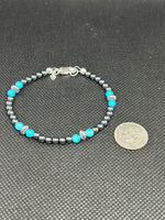 Handcrafted sterling silver and turquoise bracelet with fully oxidized silver beads.  7”.  SR1131