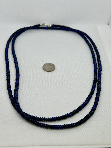 Genuine Lapis stones cut into saucer beads in a 42” necklace with sterling silver. SR 2007