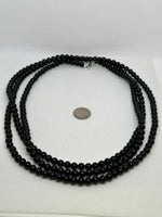 60” Black Onyx necklace with sterling silver.  Wrap around your neck or wear it long.  SR2005