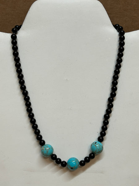 Genuine Black Onyx and recon Turquoise necklace with stainless steel beads and clasps, 17” long.  EP176