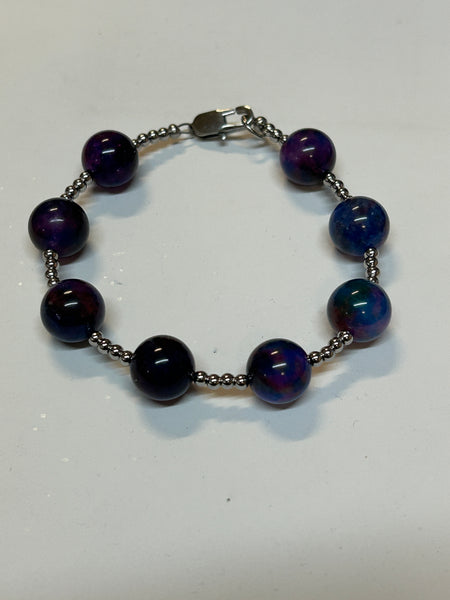 Light Sugulite bracelet with stainless steel beads and clasp. EP186