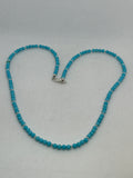 Turquoise stones with sterling silver strung into a fine quality necjkacw. SR2065