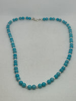 Turquoise 6mm round stone necklace with sterling silver and 21” long.  SR2063