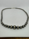 Navajo style pearl beads in sterling silver, 22”. 4mm to 16mm. 22” long.  SR2062