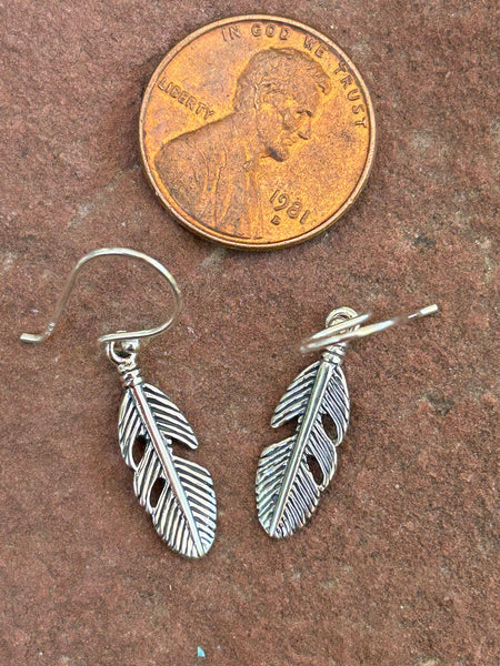 Sterling silver feather earrings. PS19