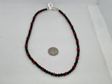 Genuine Red Coral and black onyx (4mm) in a 16” necklace with sterling silver.  SR2043