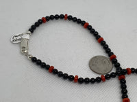 Genuine Red Coral and black onyx (4mm) in a 16” necklace with sterling silver.  SR2043