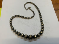 Navajo style pearl beads in sterling silver, 22”. 4mm to 16mm. 22” long.  SR2062