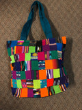 Handwoven Guatemalan cotton patches fashioned into a sturdy shoulder bag, fully lined with one zipper pocket. 15” x 17”