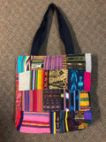 Handwoven Guatemalan cotton patches fashioned into a sturdy shoulder bag, fully lined with one zipper pocket. 15” x 17”