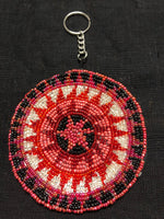 Guatemalan handcrafted glass bead round change purse with key ring. 3.5” diameter.